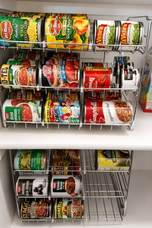 Space-saving canned food rack organizer storing soup, vegetables, beans and other pantry staples.