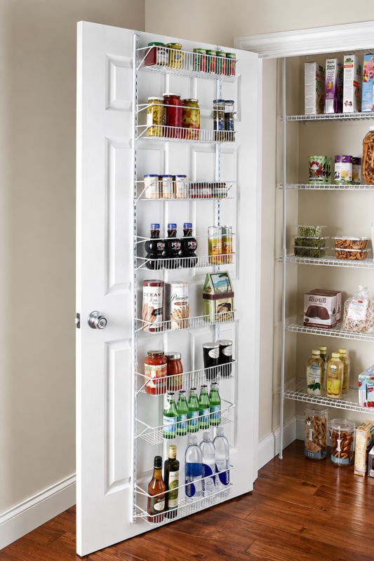 Corner pantry organization with clear snack bins, labeled baskets, canned goods and food storage containers.