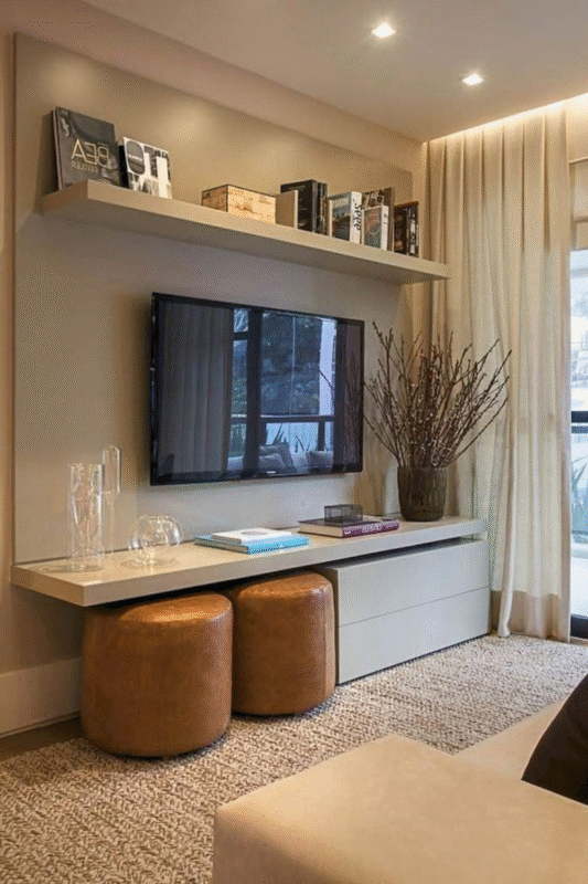 modern beige tv wall with floating shelf and neutral decor
