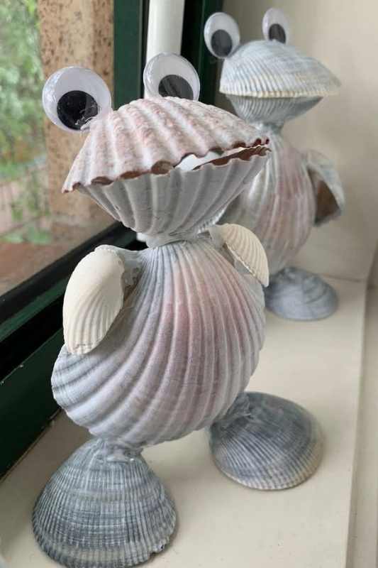 Seashell animal figures made with glued shells and googly eyes as a fun summer craft for kids