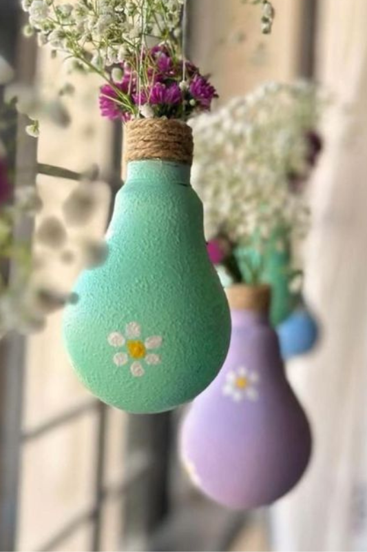 Painted light bulb flower vases with twine detail holding dried flowers for summer home decor