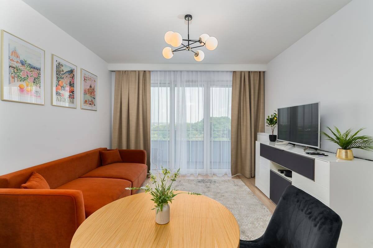 square small living room layout with centered sofa and TV arrangement