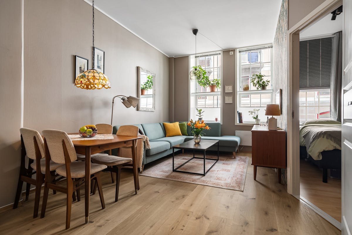 multipurpose small living room layout with sectional seating and dining area