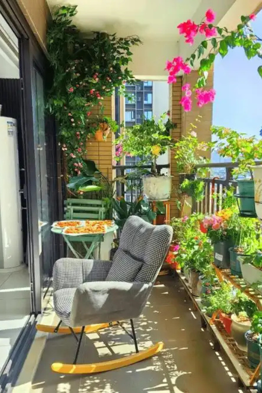 Narrow balcony styled with layered plants, compact seating, and warm natural textures for a high end look