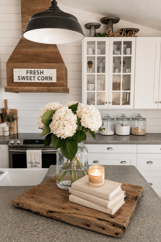Farmhouse kitchen island decor with hydrangeas and rustic wood tray