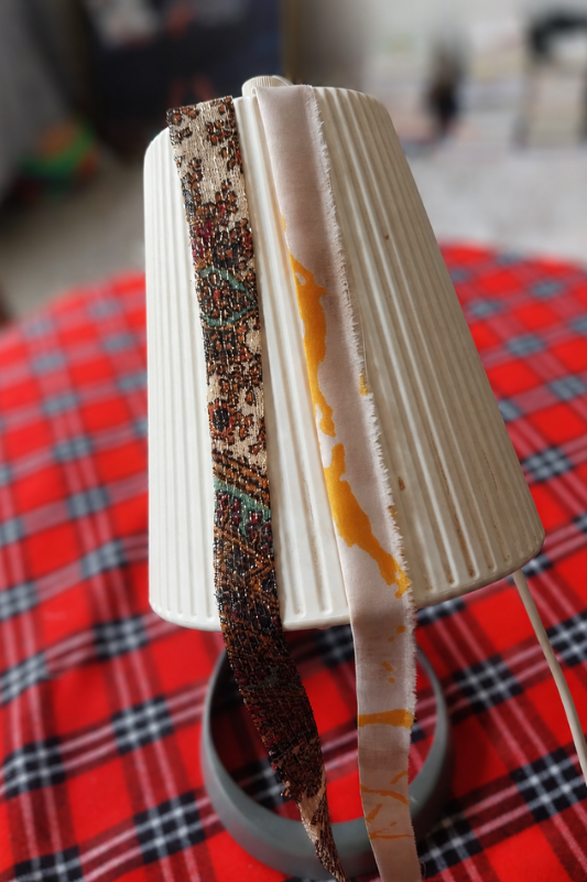 Comparing leftover fabric patterns for an easy fabric lamp makeover