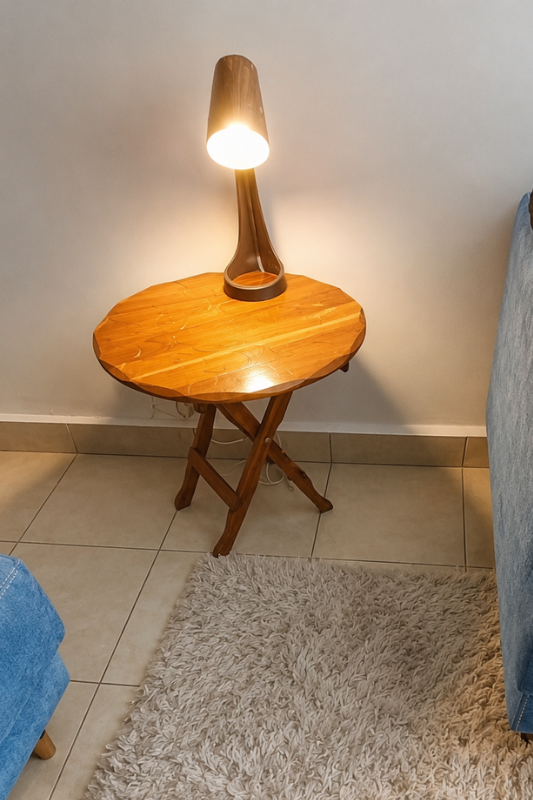 Finished DIY fabric lamp makeover styled on a wooden side table beside a sofa