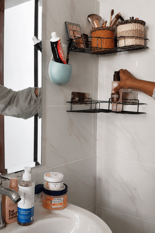 Using baskets for makeup and bathroom shelf organization