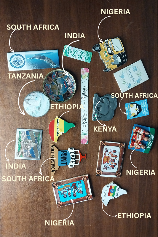 Colorful travel magnets being sorted before decorating the fridge