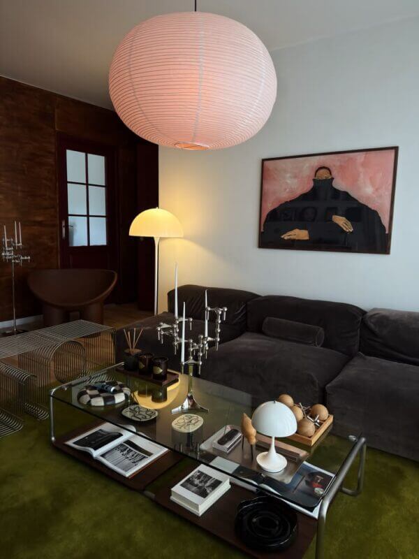 Living room using pendant, floor and table lamps to create layered ambient lighting